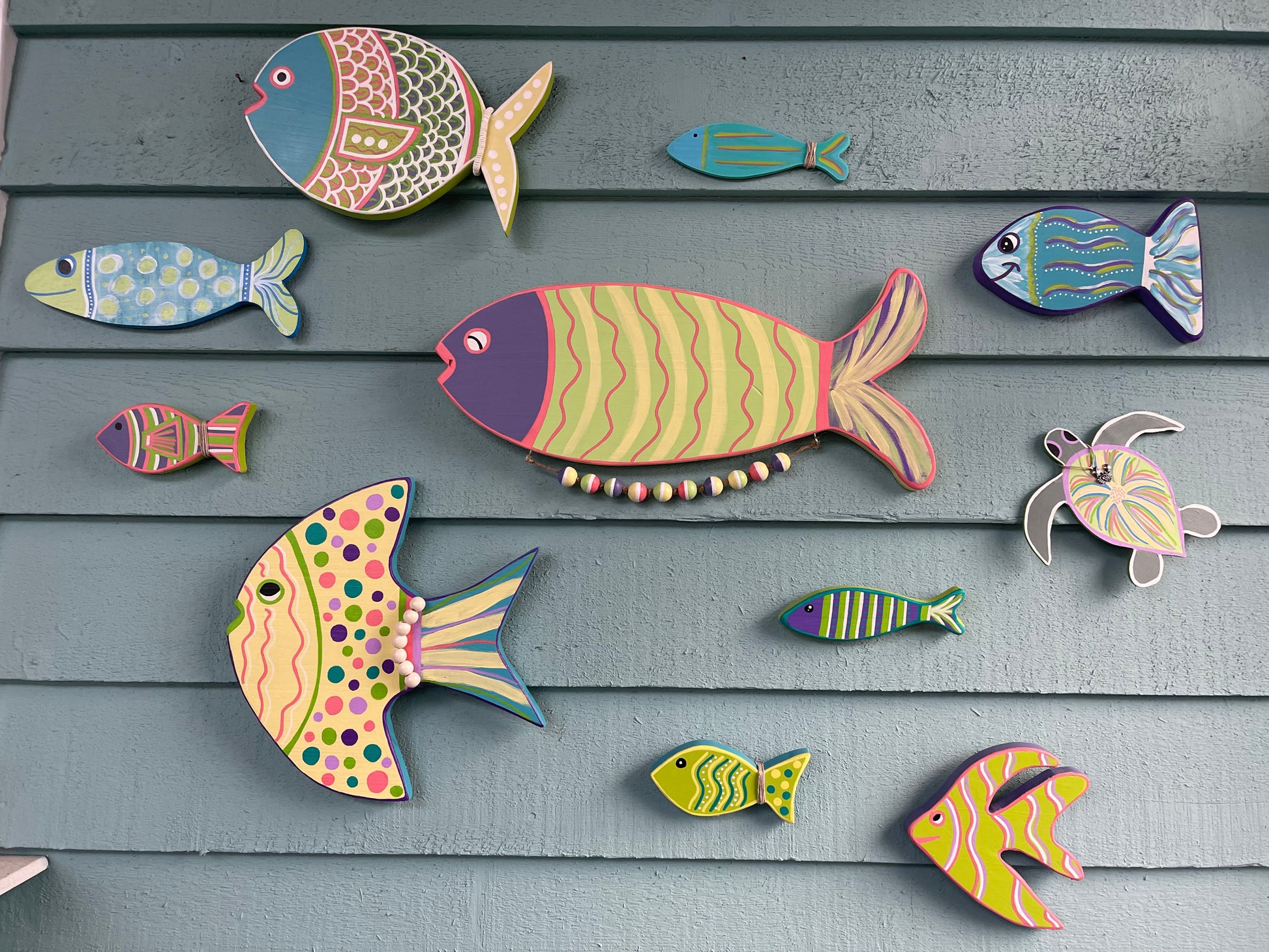 These are fish that were custom painted to match a home redesign; they were placed in a stairwell so it looks like you are walking under water. Cool!